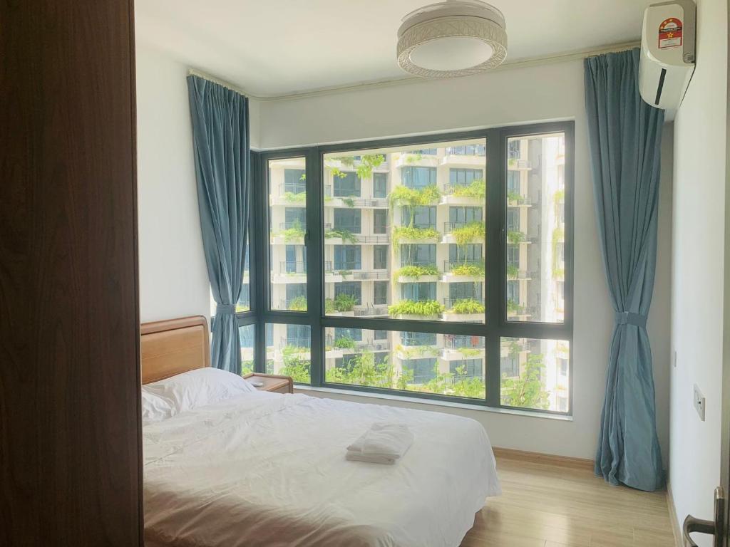 Postel nebo postele na pokoji v ubytování 高性价比三房民宿