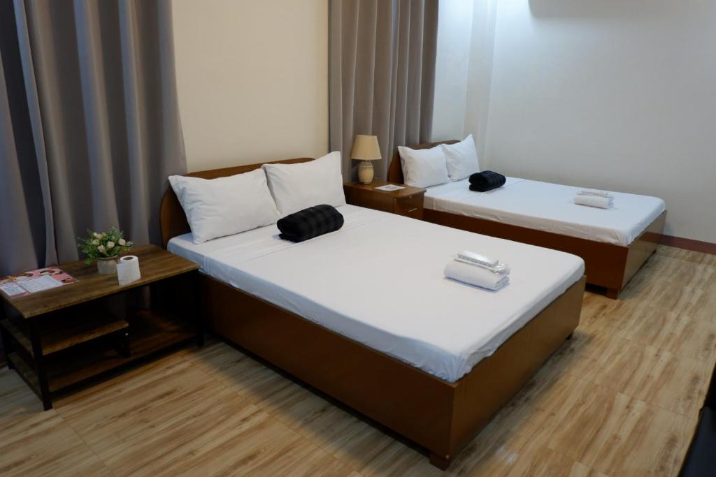 Postel nebo postele na pokoji v ubytování JUN's INN