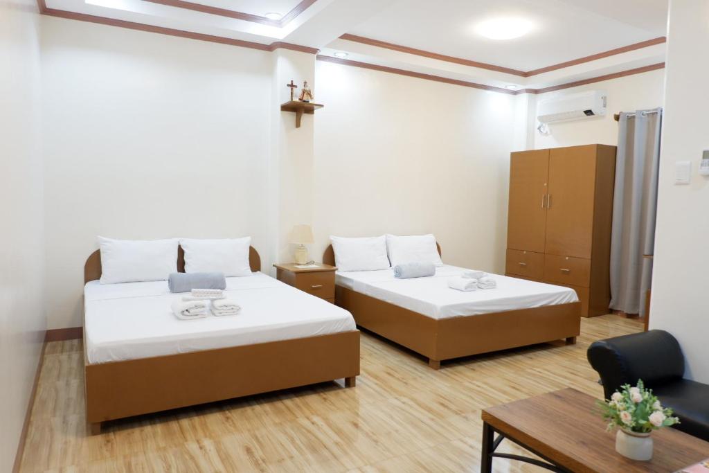 Postel nebo postele na pokoji v ubytování JUN's INN