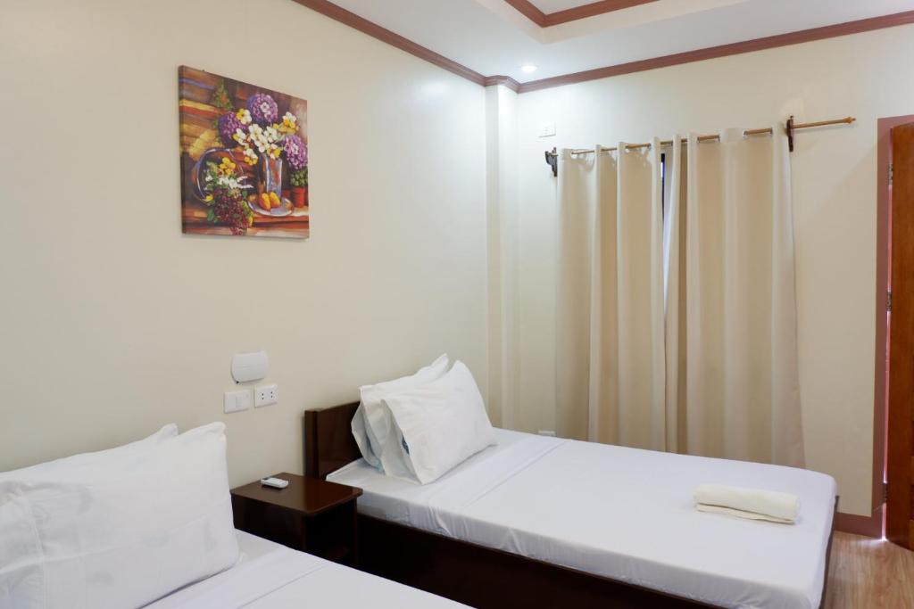 Postel nebo postele na pokoji v ubytování JUN's INN