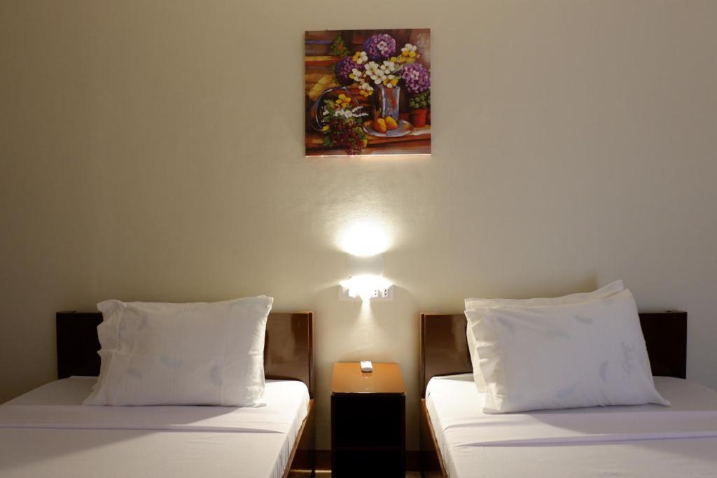 Postel nebo postele na pokoji v ubytování JUN's INN