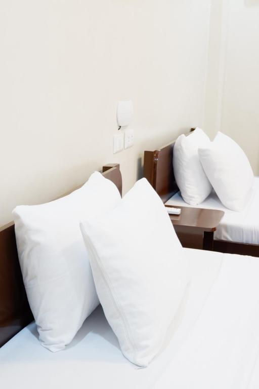 Postel nebo postele na pokoji v ubytování JUN's INN