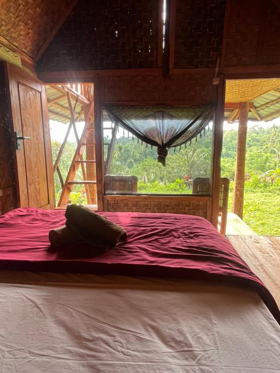 Voodi või voodid majutusasutuse Tetebatu Jungle Vibes toas