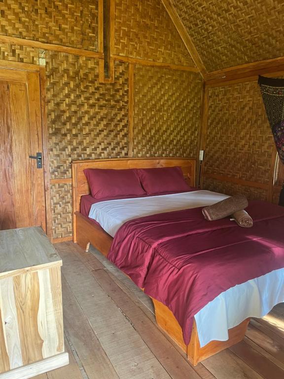 Voodi või voodid majutusasutuse Tetebatu Jungle Vibes toas