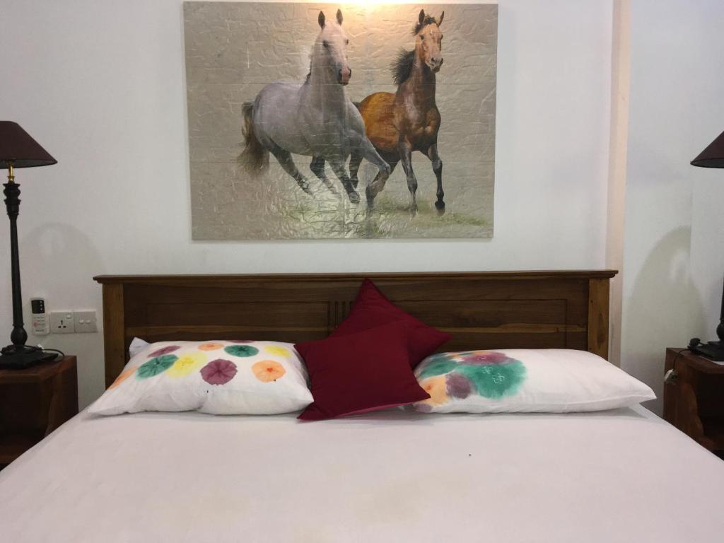Postel nebo postele na pokoji v ubytování Ceylonika Rest