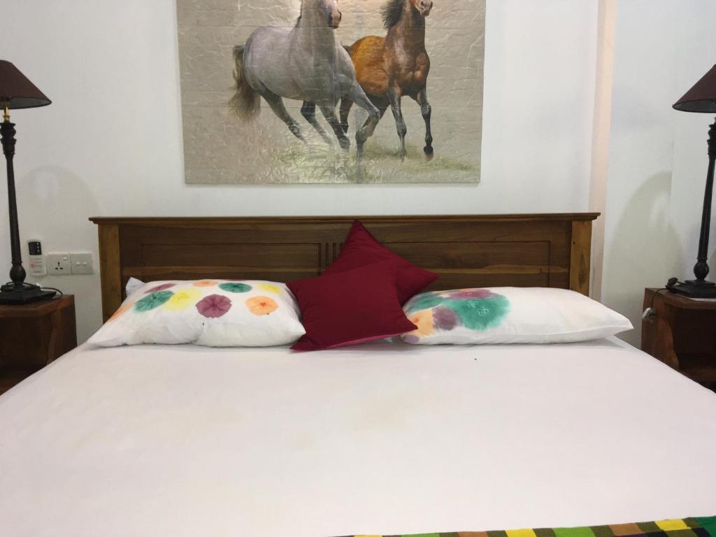 Postel nebo postele na pokoji v ubytování Ceylonika Rest