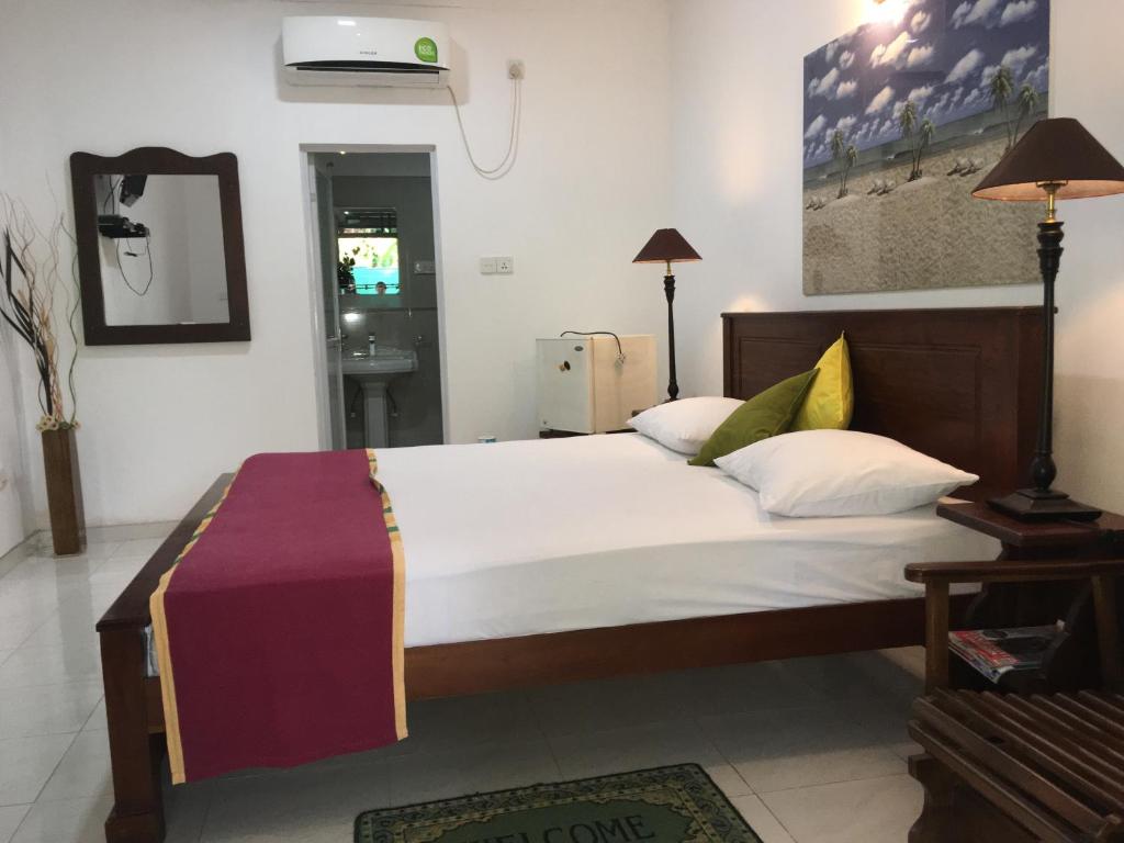 Postel nebo postele na pokoji v ubytování Ceylonika Rest
