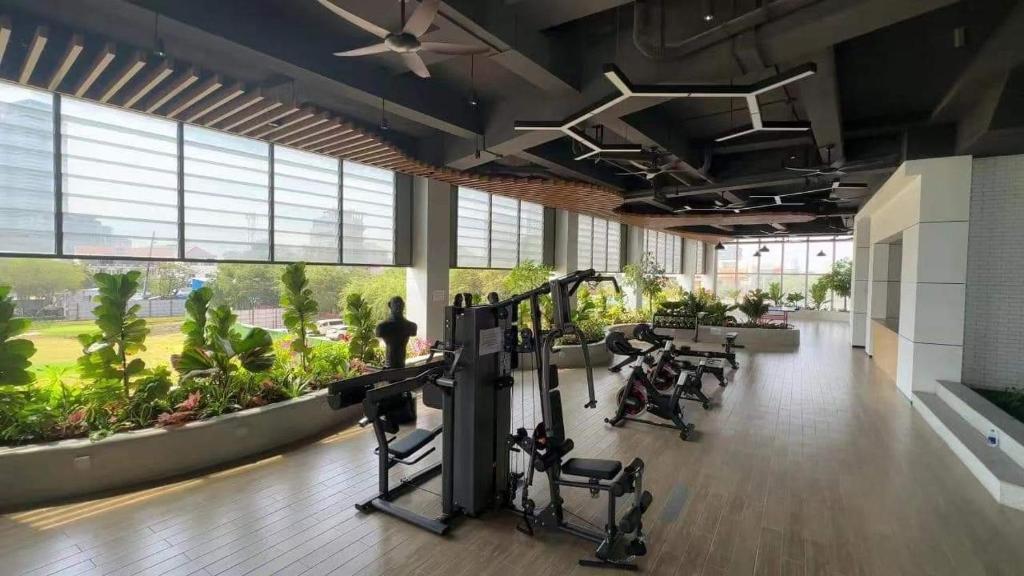 a gym with cardio equipment in a building at Morgan enmaison in Phnom Penh