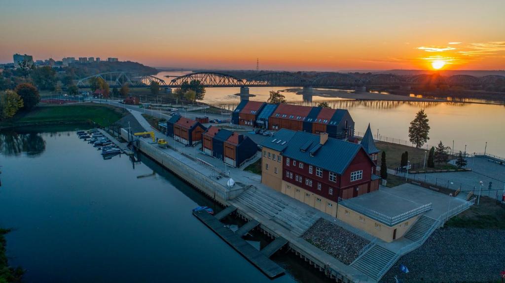 an aerial view of a marina at sunset at Marina Grudziądz in Grudziądz