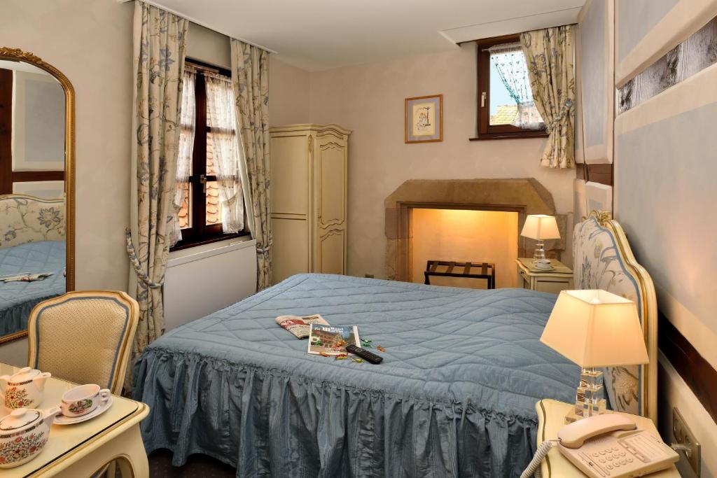 Postel nebo postele na pokoji v ubytování Hotel Saint-Martin