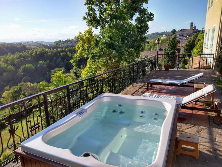 a hot tub on the balcony of a house at Al Cedro Terrazza sul Monferrato con Idromassaggio in Grazzano Badoglio