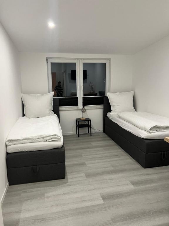 Ένα ή περισσότερα κρεβάτια σε δωμάτιο στο Pension An der Mühle