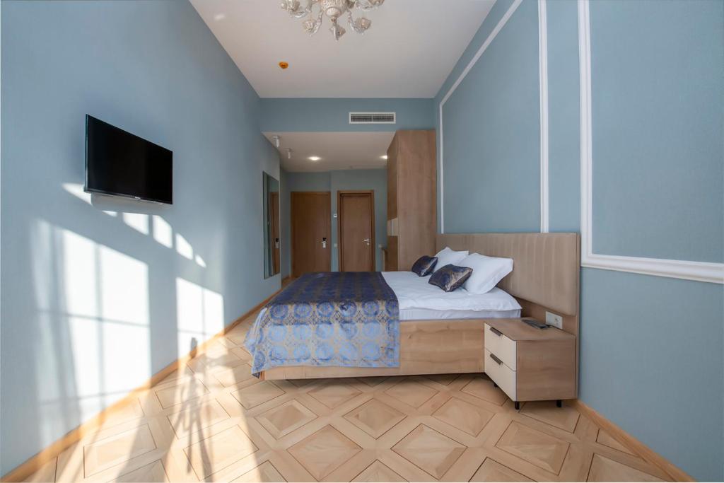 Postel nebo postele na pokoji v ubytování Metekhi Boutique Hotel