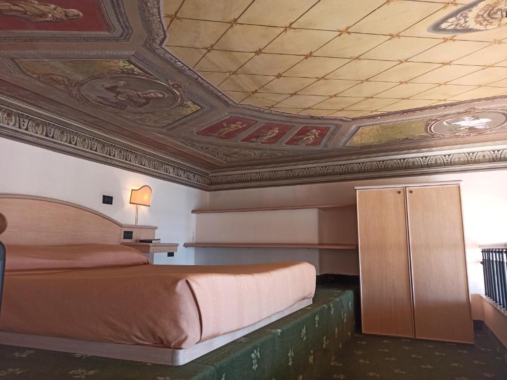 Postel nebo postele na pokoji v ubytování Hotel Miramare