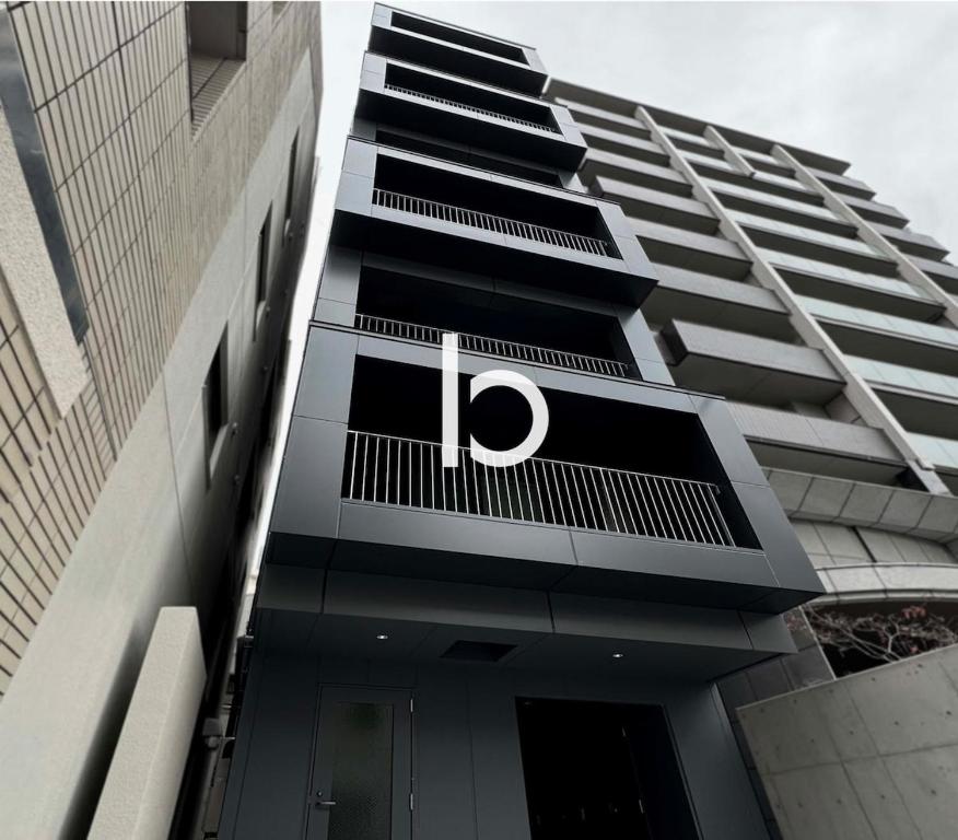 a building with the letter p on the side of it at b hotel Rijodori - Breakfast & Comfort in Hiroshima's Heart in Hiroshima