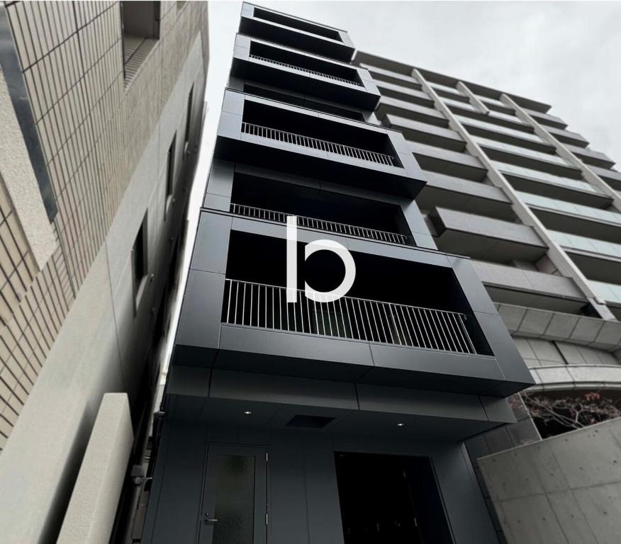 a building with the letter p on the side of it at b hotel Rijodori - City Central Studio Stay with Breakfast in Hiroshima