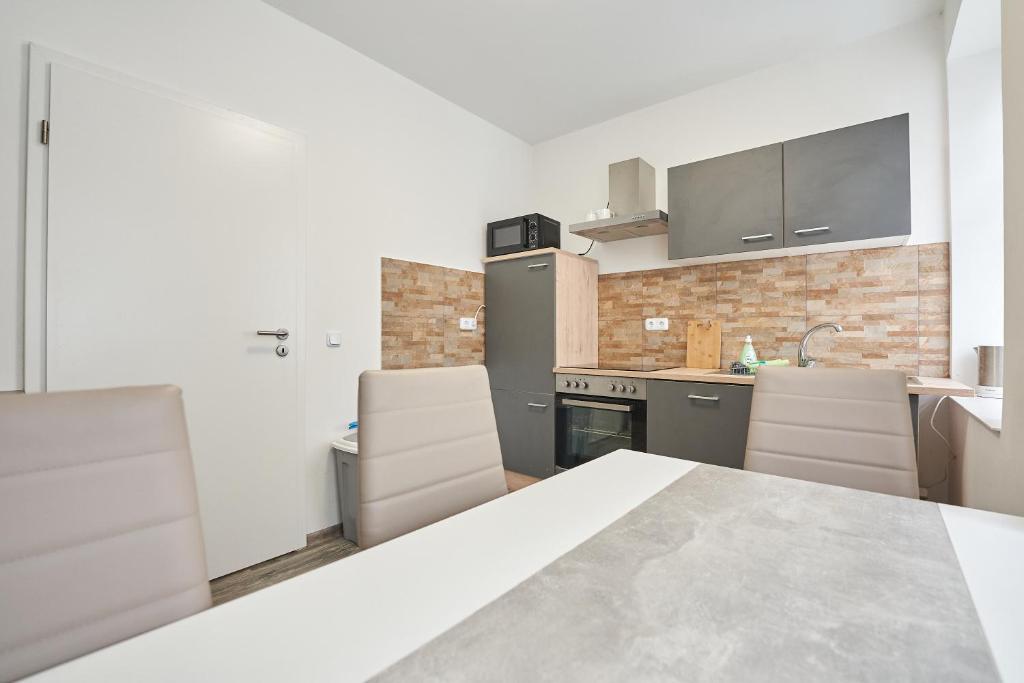 Kuchyň nebo kuchyňský kout v ubytování Monteurwohnung Glauchau