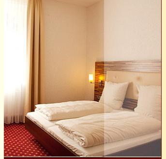 Postel nebo postele na pokoji v ubytování Hotel- Restaurant Poststuben