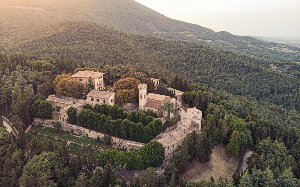 an aerial view of a castle on a hill at Borgo di Camporsevoli in Camporsevoli
