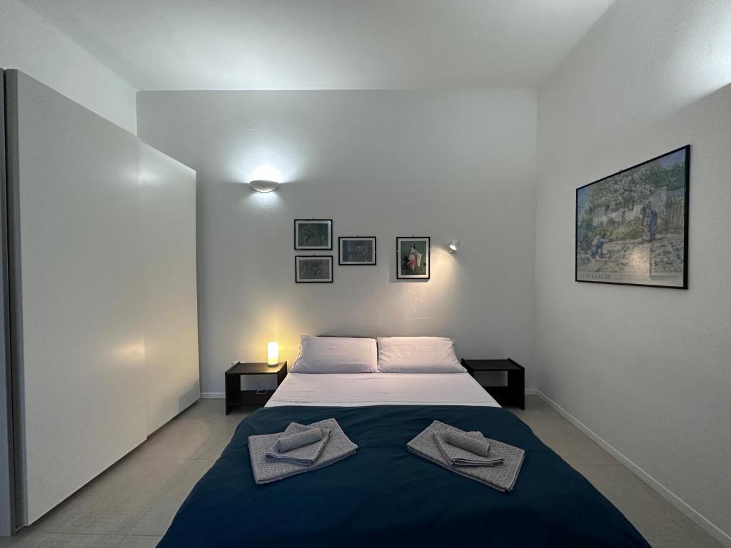 Posteľ alebo postele v izbe v ubytovaní La Casa di Leo Apartments