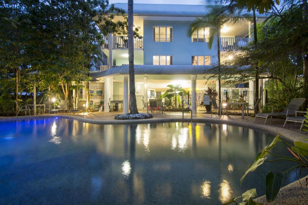 a large swimming pool in front of a building at Outrigger Apartments Port Douglas in Port Douglas