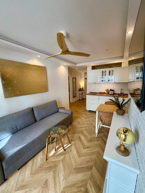 a living room with a couch and a table at MIA HOME MARBELLA in Marbella