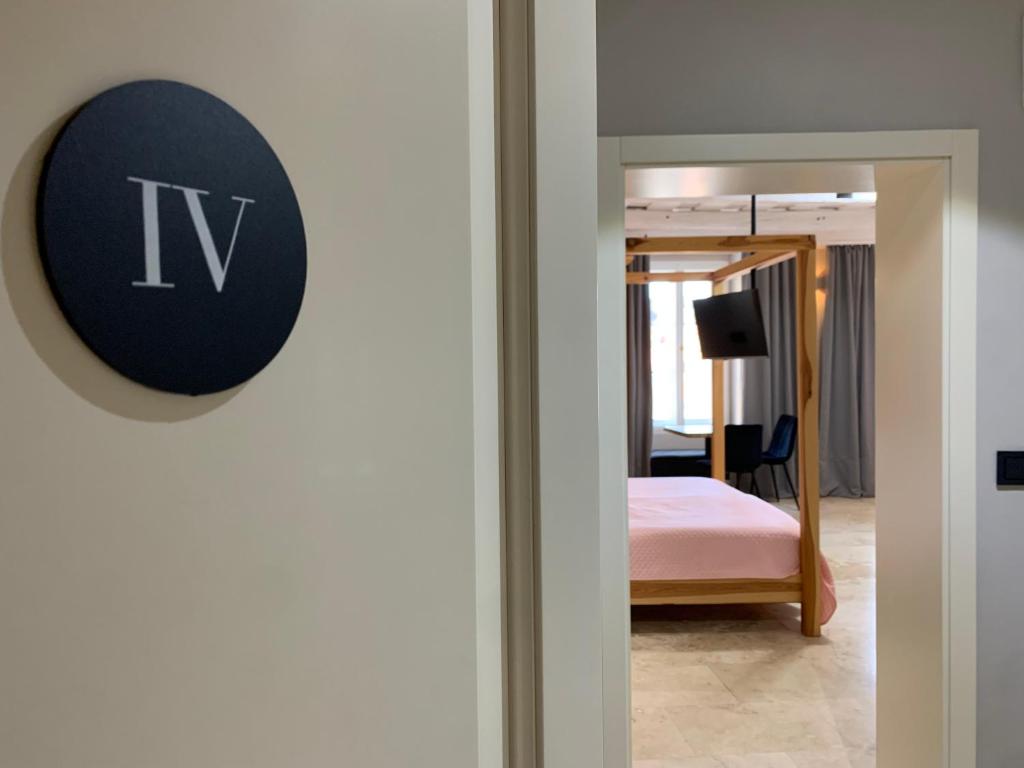 Postel nebo postele na pokoji v ubytování Hotel Desatero