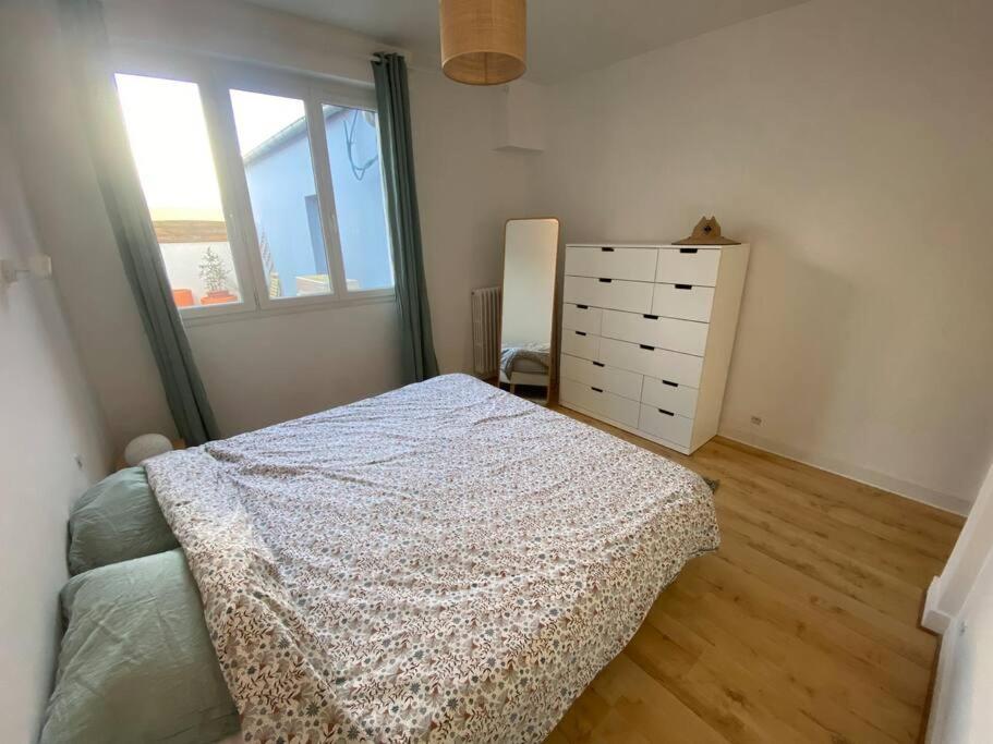 Ένα ή περισσότερα κρεβάτια σε δωμάτιο στο Appartement au pied des plages !