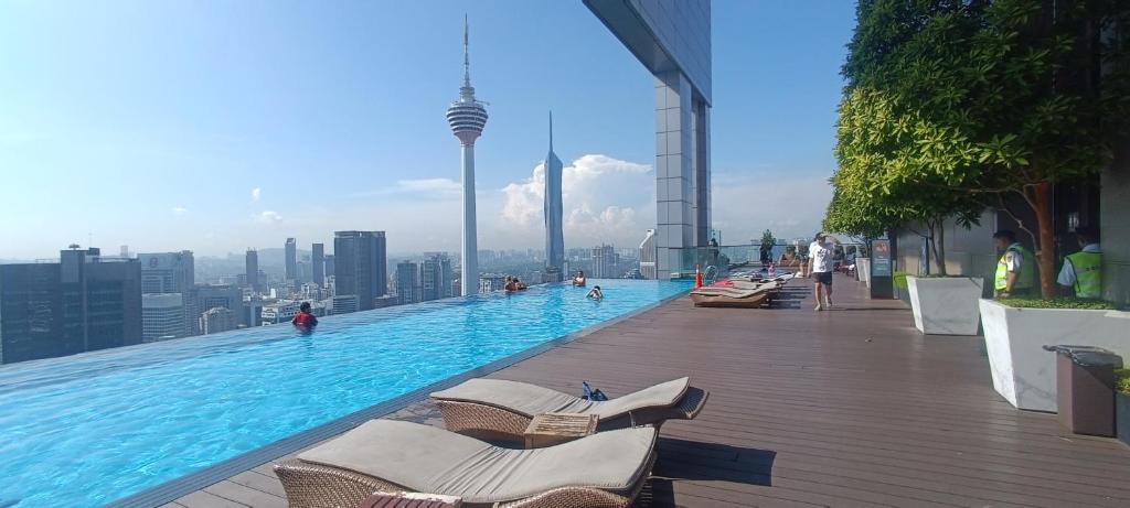 a swimming pool on the top of a building at SKYWARD SUITE KLCC in Kuala Lumpur