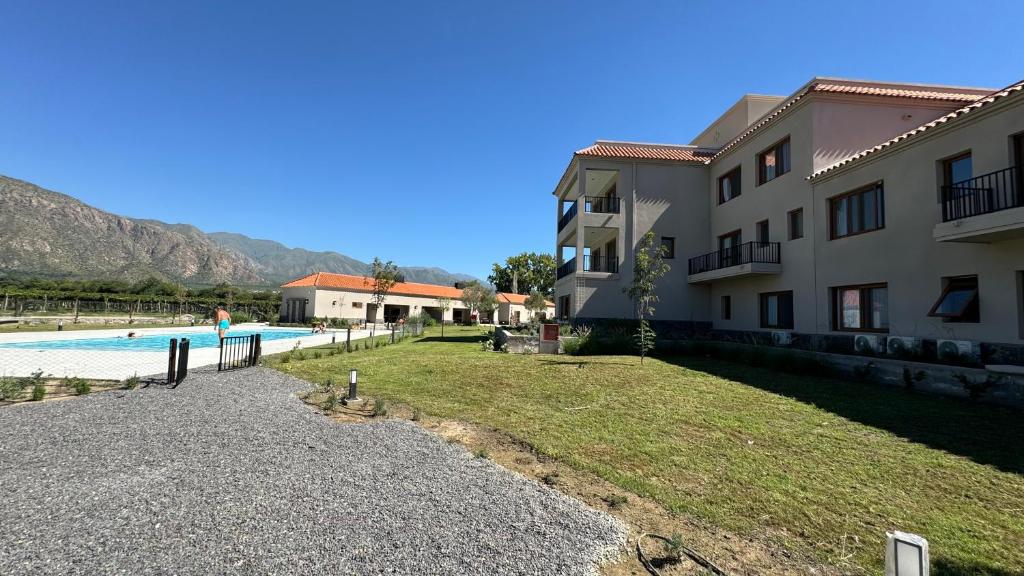 a view of a building and a swimming pool at BuenaVid estancias in Cafayate