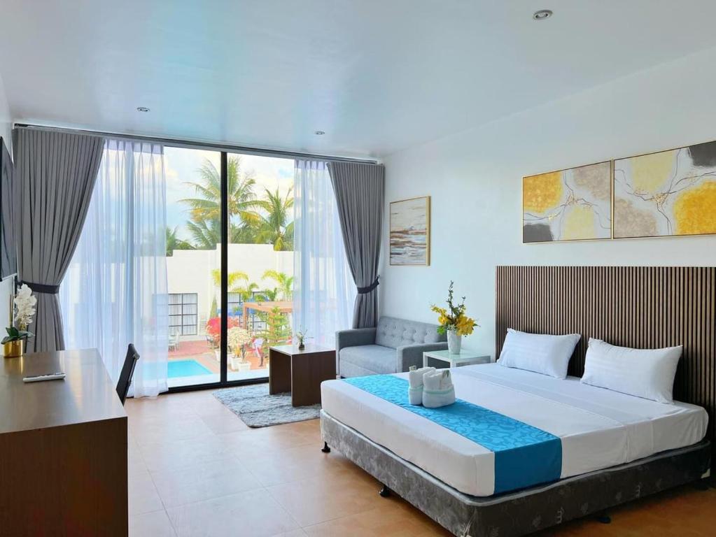 Postel nebo postele na pokoji v ubytování Grand Palmera Hotel