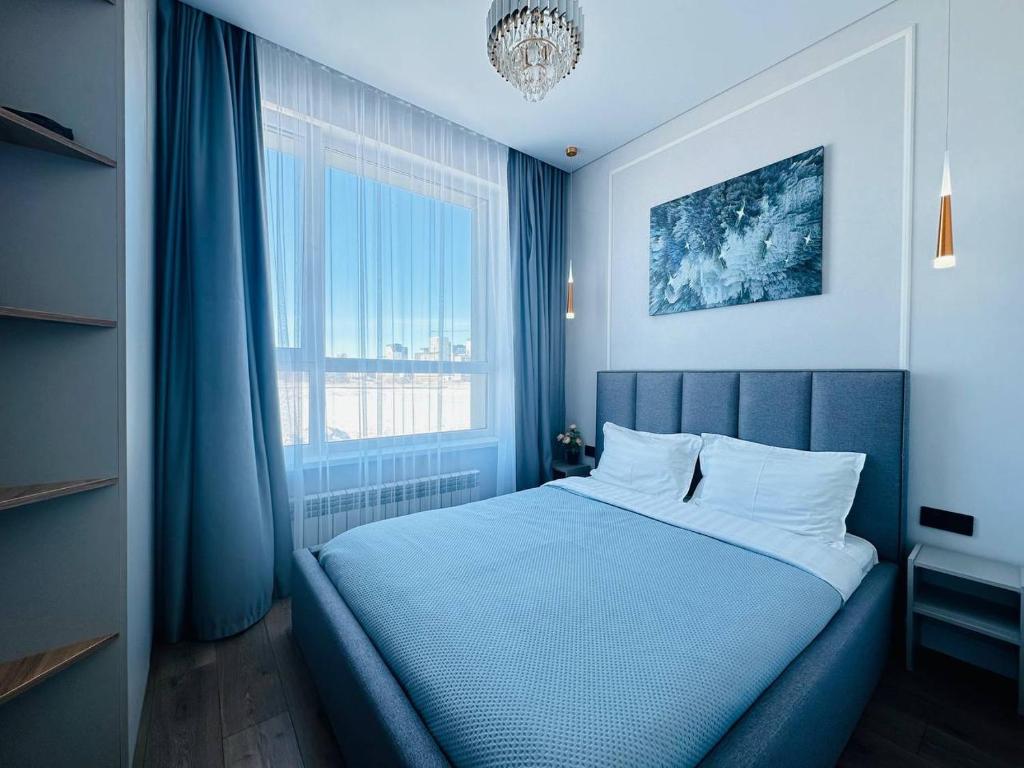 Säng eller sängar i ett rum på Кок Жайлау apartament