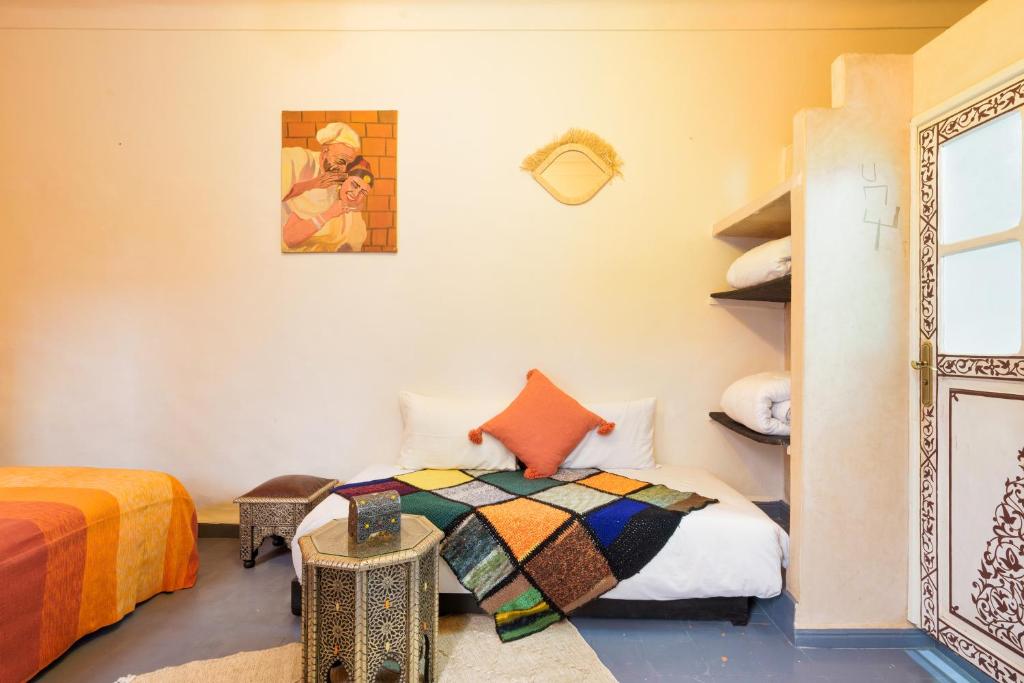 Postel nebo postele na pokoji v ubytování RIAD MAMAHOUSE