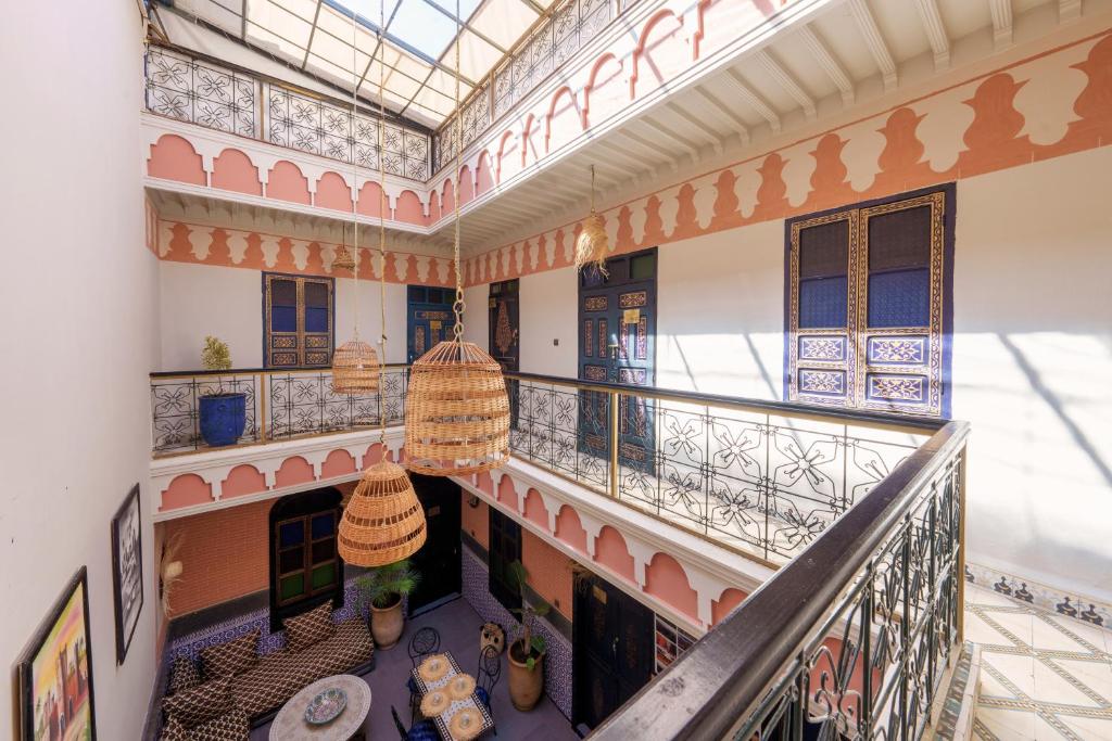 an overhead view of a building with a balcony at RIAD MAMAHOUSE in Marrakech