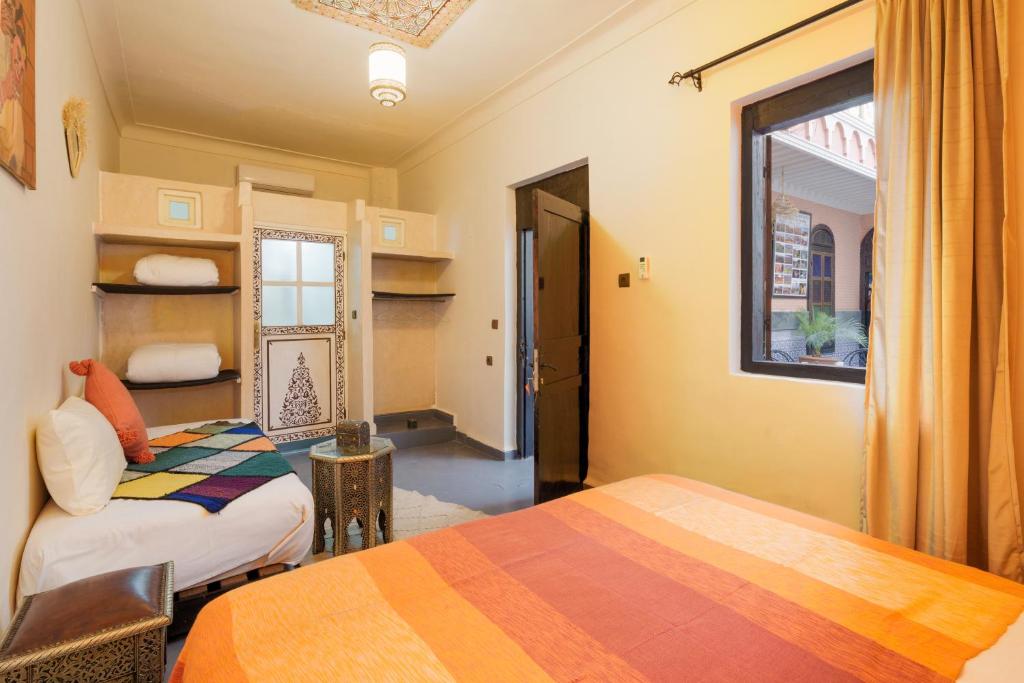Postel nebo postele na pokoji v ubytování RIAD MAMAHOUSE