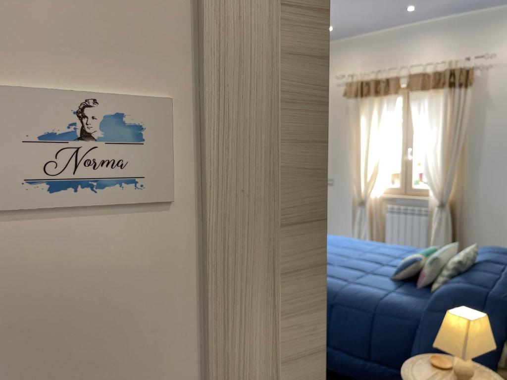 A bed or beds in a room at Dimora Bellini