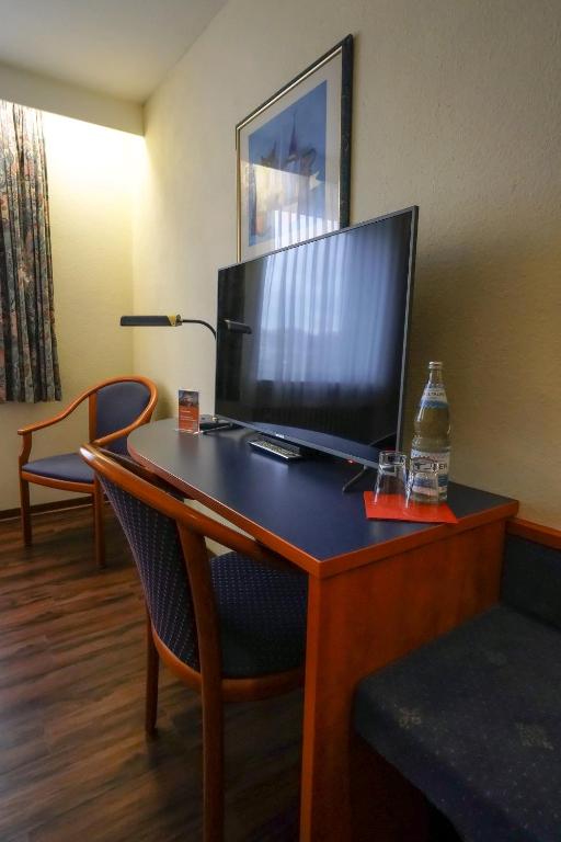 TV a/nebo společenská místnost v ubytování Hotel Stadt Daun