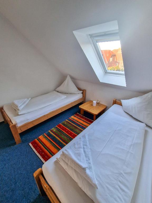 Postel nebo postele na pokoji v ubytování Frisia