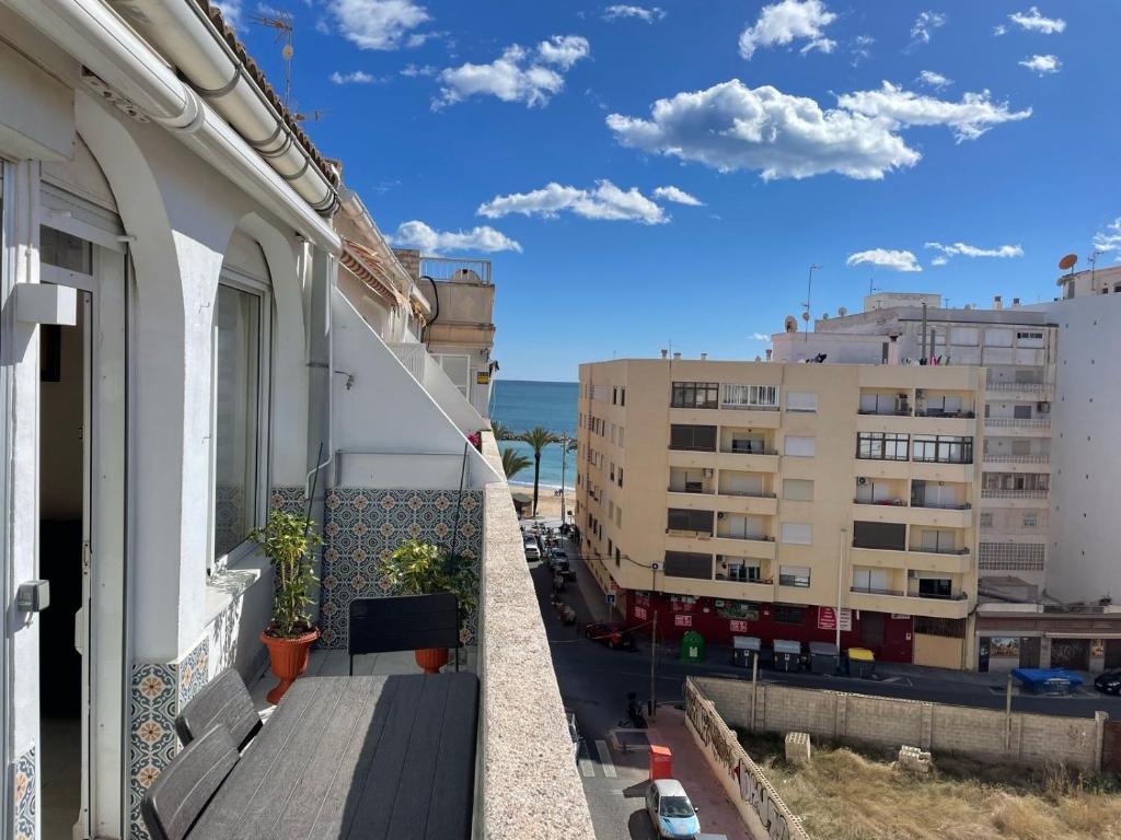 a balcony with a view of a building at Apartment Monserrate K atico in Torrevieja