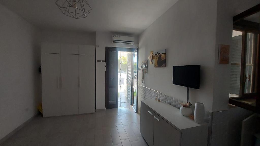 TV a/nebo společenská místnost v ubytování Casa Neve al mare