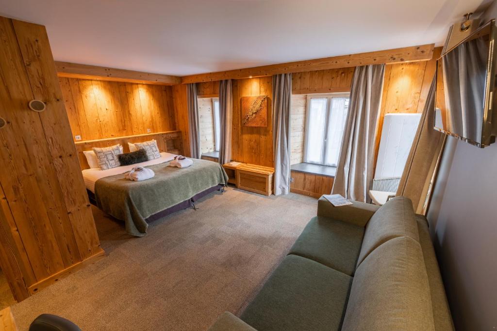 Postel nebo postele na pokoji v ubytování Hôtel et Spa les Clarines