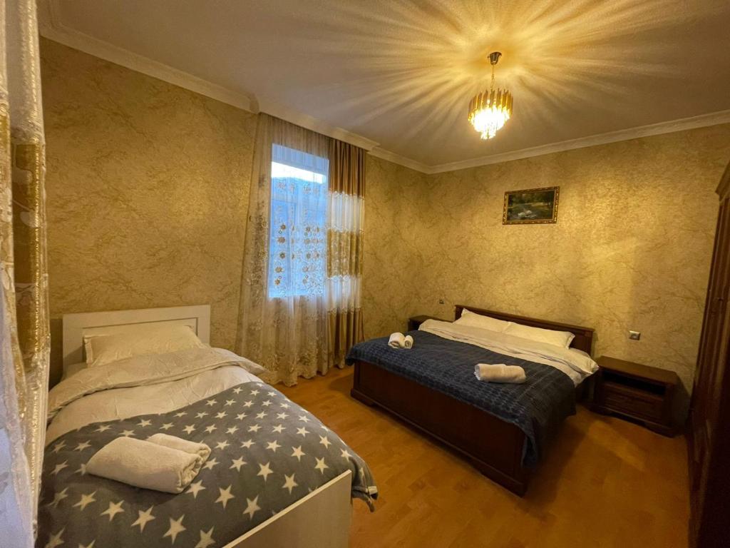 Postel nebo postele na pokoji v ubytování Hotel Tsiskari