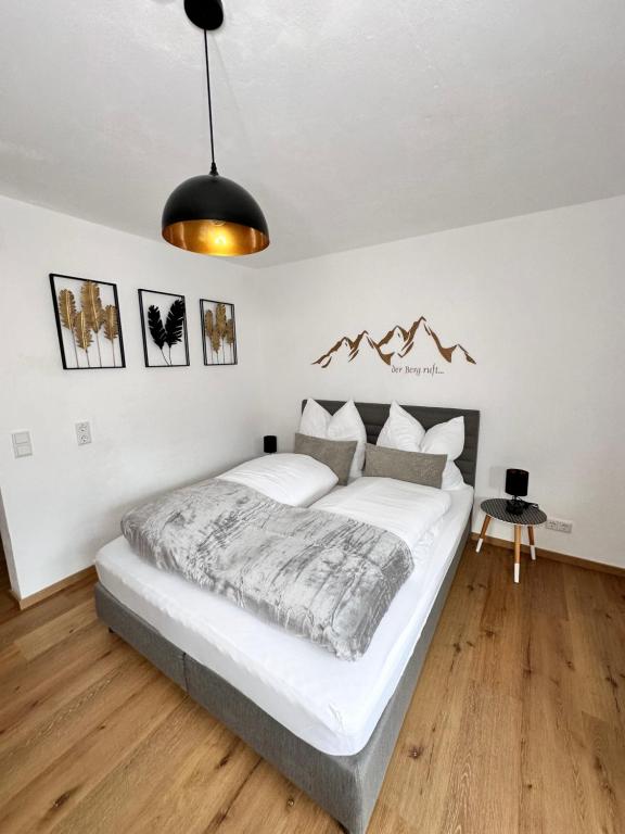 a bedroom with a large bed in a room at Grimming Lodge Tauplitz in Tauplitz