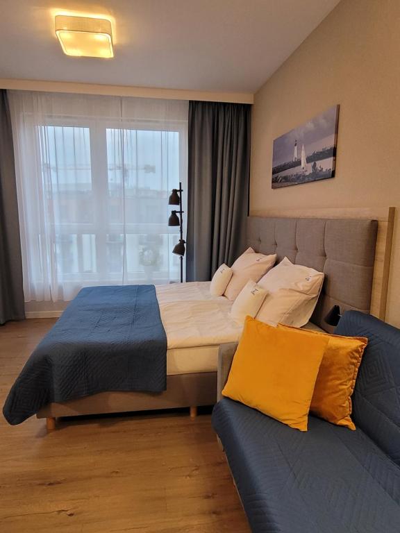 Posteľ alebo postele v izbe v ubytovaní Bel Mare Wyspa, apartament z parkingiem gratis