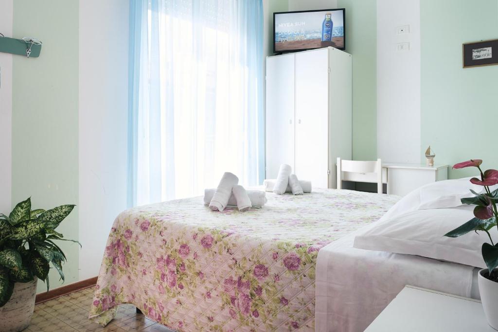 Postel nebo postele na pokoji v ubytování Hotel Cheri