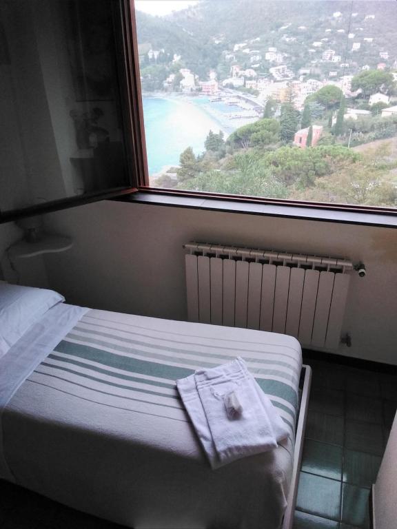 Łóżko lub łóżka w pokoju w obiekcie VILLA MIMOSA Splendida Vista Mare