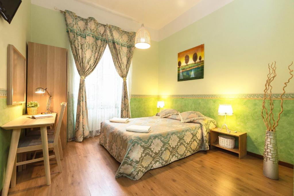 Кровать или кровати в номере Holiday Sunny Roma B&B