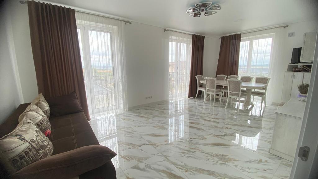 a living room with a couch and a table at Apartament in Bălţi