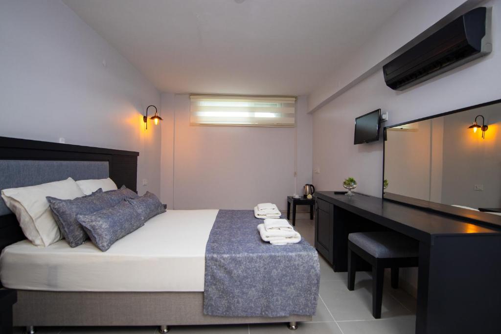 Postel nebo postele na pokoji v ubytování Hotel Le Marin