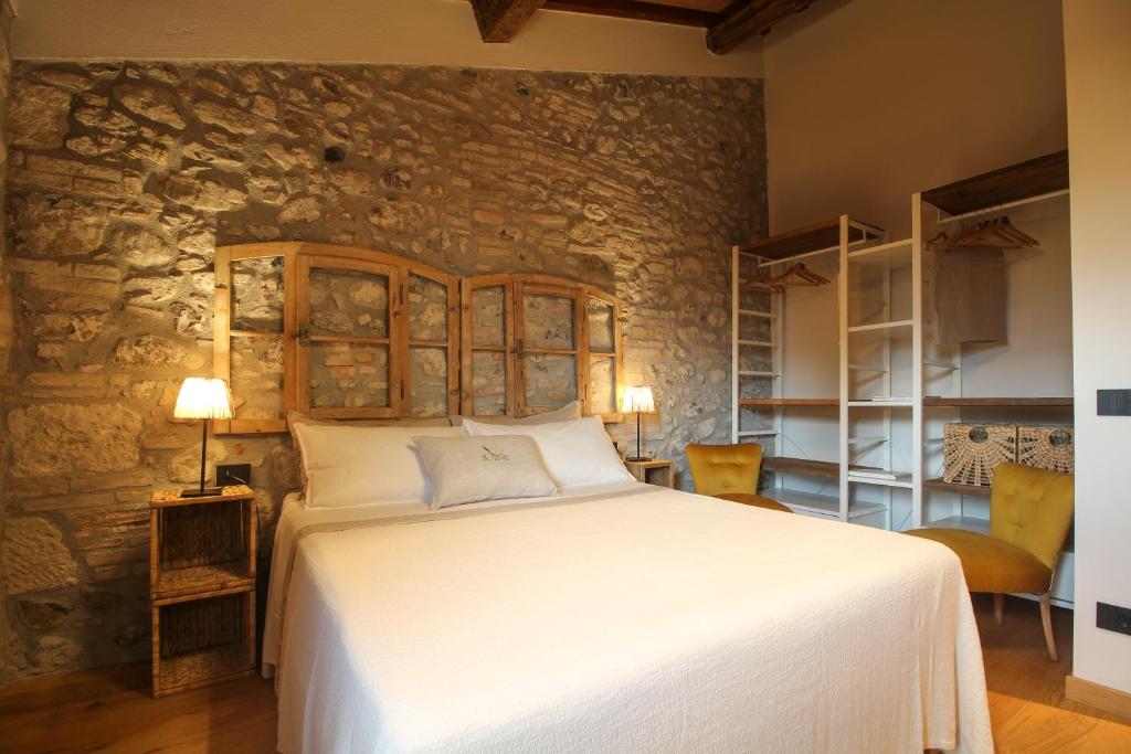 Ένα ή περισσότερα κρεβάτια σε δωμάτιο στο Agriturismo iOlive Tuscany appartamento LECCINO